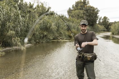 man fishing river